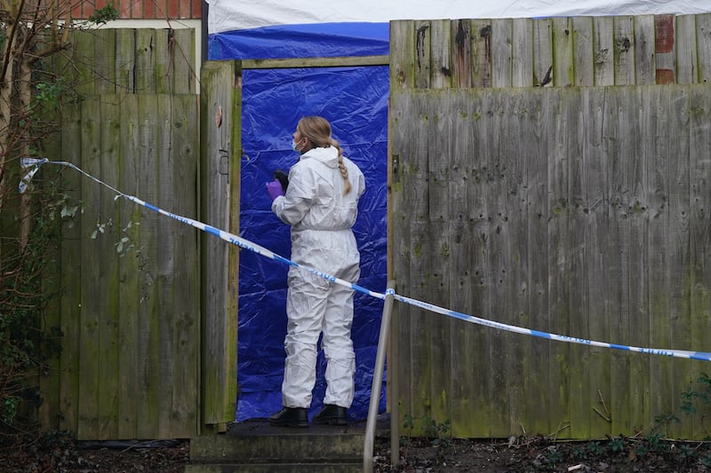 A forensic investigator at the scene