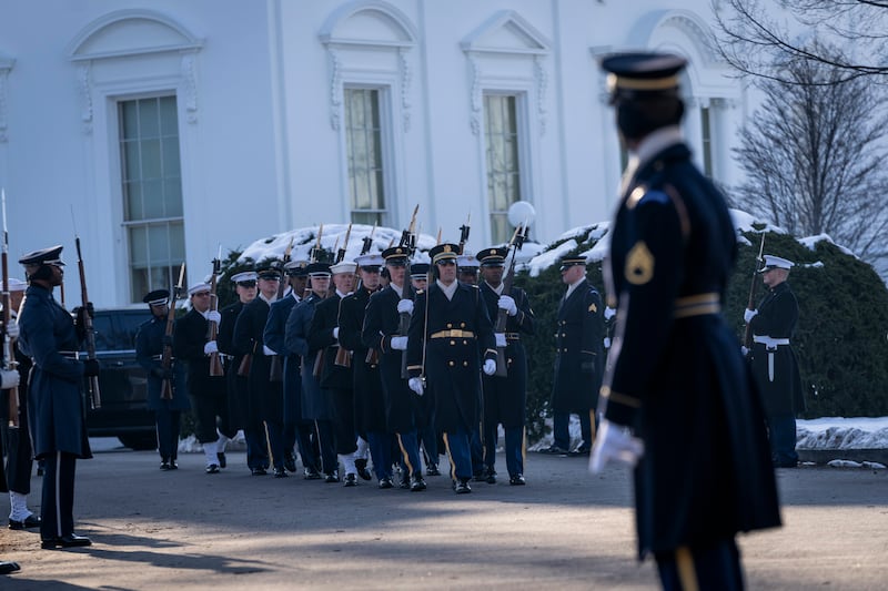 Members of the US military Joint Honour Guard parade as they rehearse ahead of the upcoming presidential inauguration (Ben Curtis/AP)