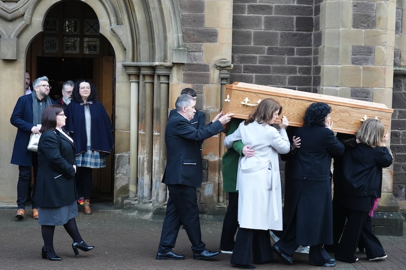 Godley’s coffin is carried out of the cathedral