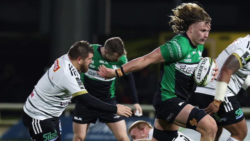 Cian Prendergast, with ball in hand, in the green of Connacht - he's hoping to wear the Ireland variant at the Rugby World Cup.