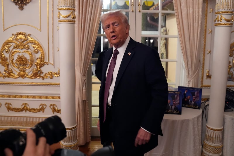 President-elect Donald Trump arrives to speak during a meeting with Republican governors at Mar-a-Lago in Palm Beach, Florida (Evan Vucci/AP)