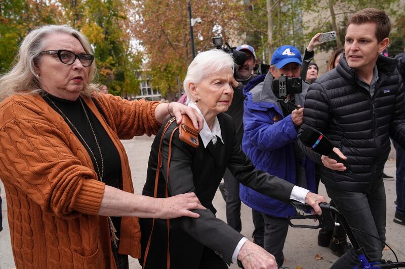 Erik and Lyle Menendez’s aunt Joan VanderMolen, centre, arrives at the courthouse (Jae C Hong/AP)