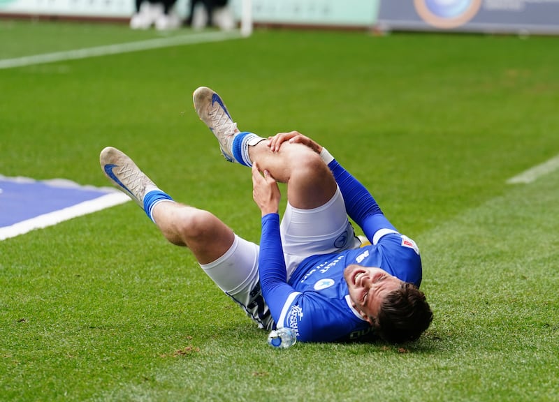 Ollie Tanner gets his foot injured from it being trapped under an advertising board at Swansea