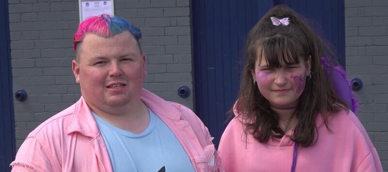 Kieran, 26, and Olivia, 12, pictured in bright-coloured outfits ahead of Taylor Swift’s performance.