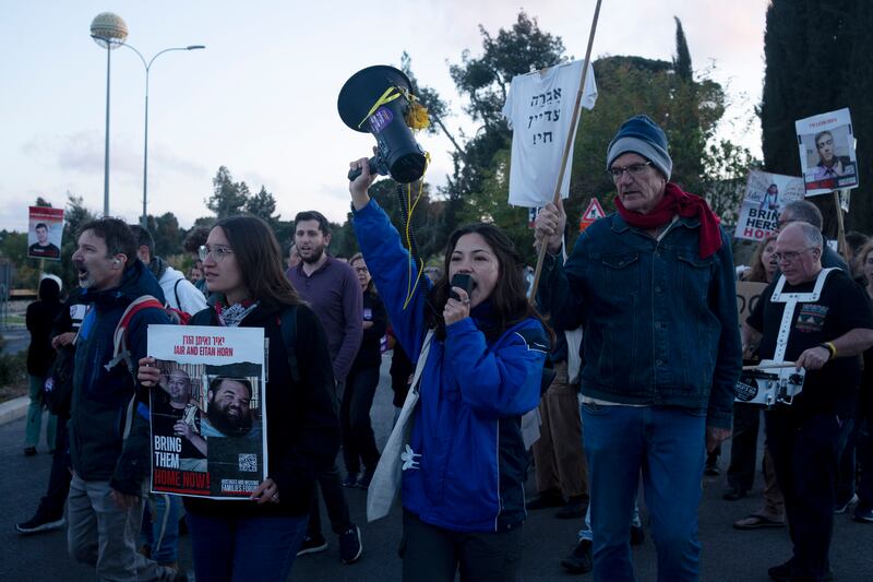 Relatives of hostages held in Gaza and their supporters move into an intersection to protest outside the Prime Minister’s Office in Jerusalem to call for an immediate release of the captives for the Jewish holiday of Passover (Maya Alleruzzo/AP)