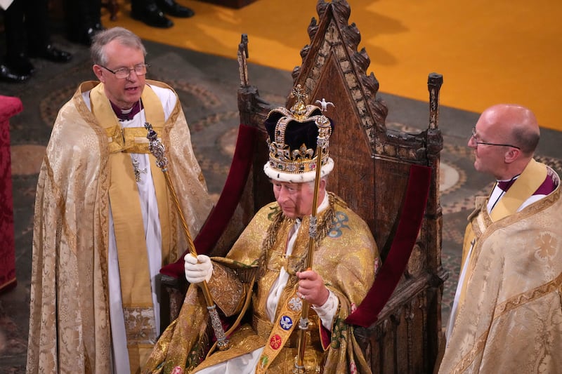 The King, the head of the Church of England, after being crowned with St Edward’s Crown in May 2023