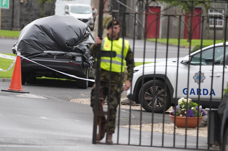 A car wrapped in plastic at the scene at Renmore Barracks