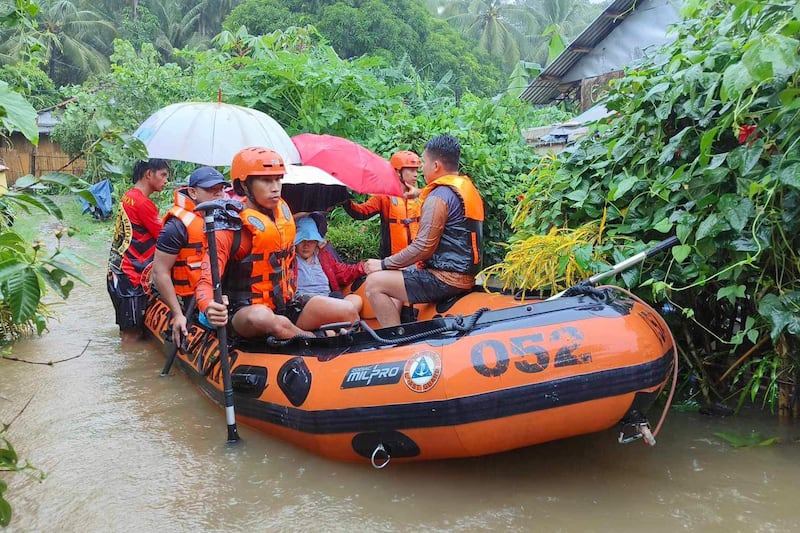 People flee to higher ground in the Northern Samar province, Philippines (Philippine Coast Guard/AP)