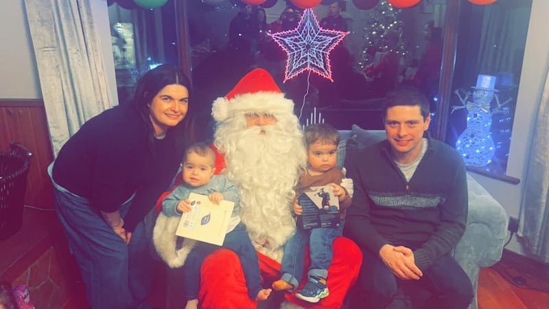 Siblings Etta (2) and Olly Cartmill (4) visiting Santa with their parents Dionne and Neil.