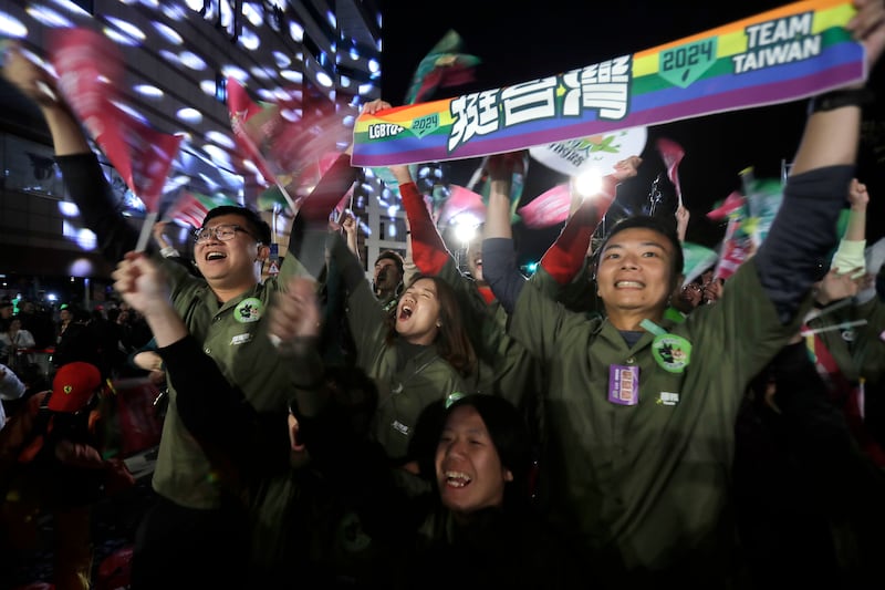 Supporters of Lai Ching-te, also known as William Lai, cheer his election victory (Chiang Ying-ying/AP)