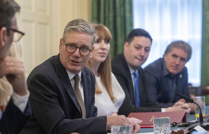 Prime Minister Sir Keir Starmer, pictured at the Cabinet table, said he was ‘not prepared to continue with gimmicks’ such as the Rwanda deportation plan to tackle English Channel small boat crossings