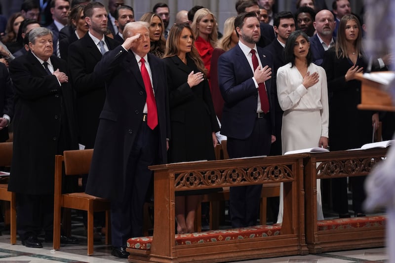 Donald Trump salutes, alongside first lady Melania Trump, vice president JD Vance and his wife Usha Vance during the national prayer service at the Washington National Cathedral (Evan Vucci/AP)