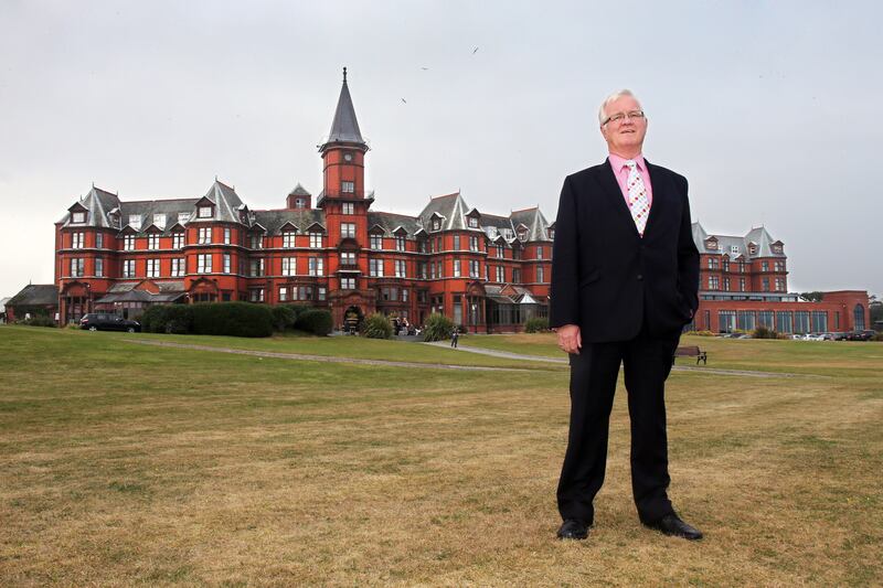 John D Toner pictured in front of the Slieve Donard Hotel in Newcastle upon his retirement in 2013 after an illustrious four decade career in the hospitality industry PICTURE: MAL MCCANN