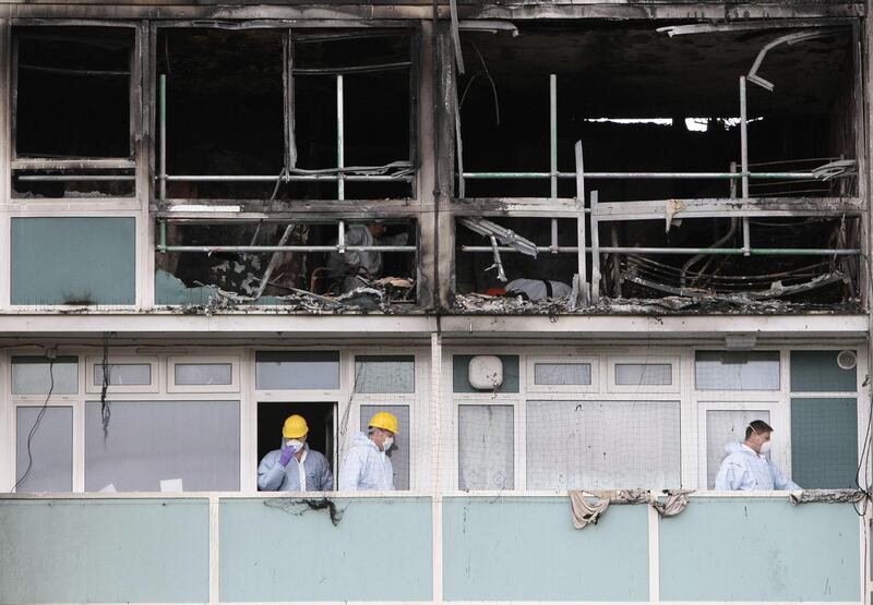 Forensic officers inspect the scene of the fire in Lakanal House in Camberwell, south London, in July 2009