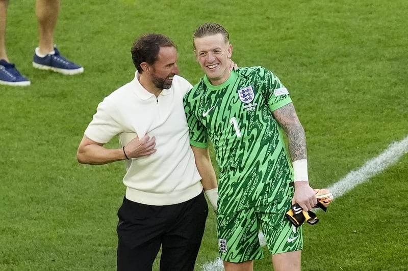 England manager Gareth Southgate celebrates with goalkeeper Jordan Pickford after the Switzerland game