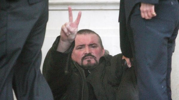 Michael Stone gives the victory sign after he attempted to enter Stormont armed on November 24, 2006