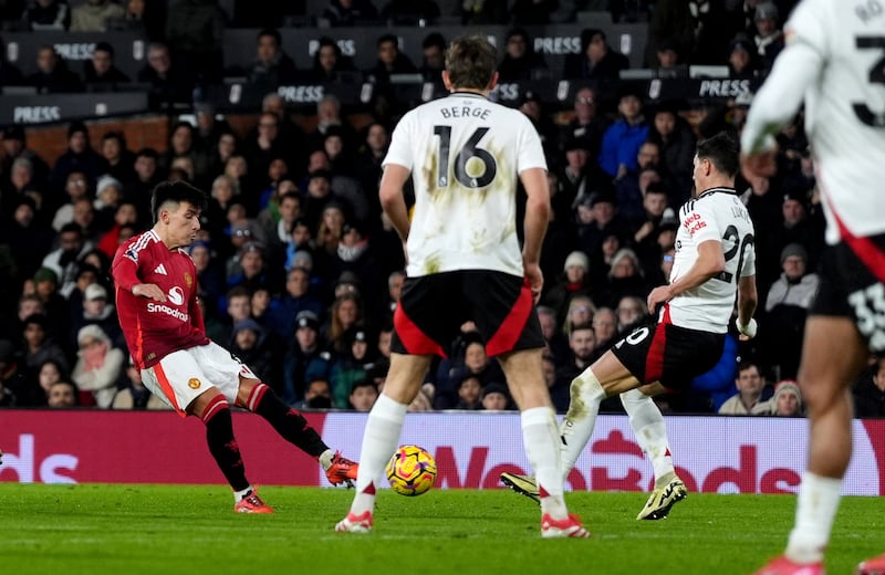 Manchester United’s Lisandro Martinez scores with a deflected shot against Fulham