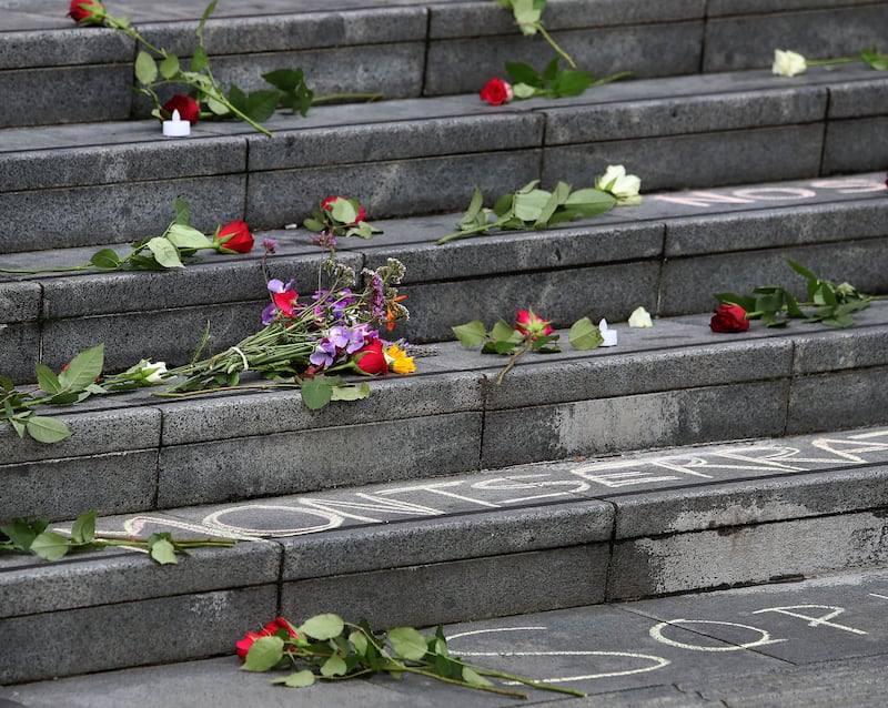 Flowers laid at the End Violence Against Women vigil at Guildhall Square in Derry on Thursday evening. Picture Margaret McLaughlin  29-8-2024