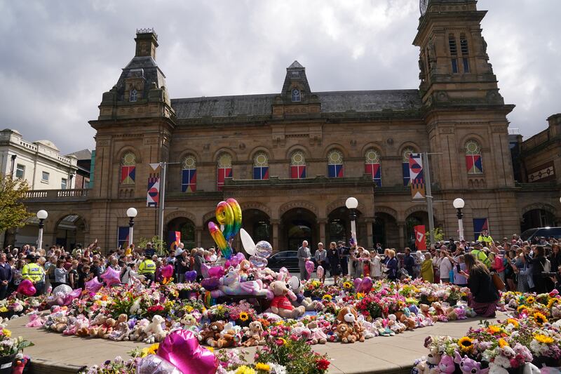 Tributes were left near the town hall where a vigil was held the night after the attack on July 29