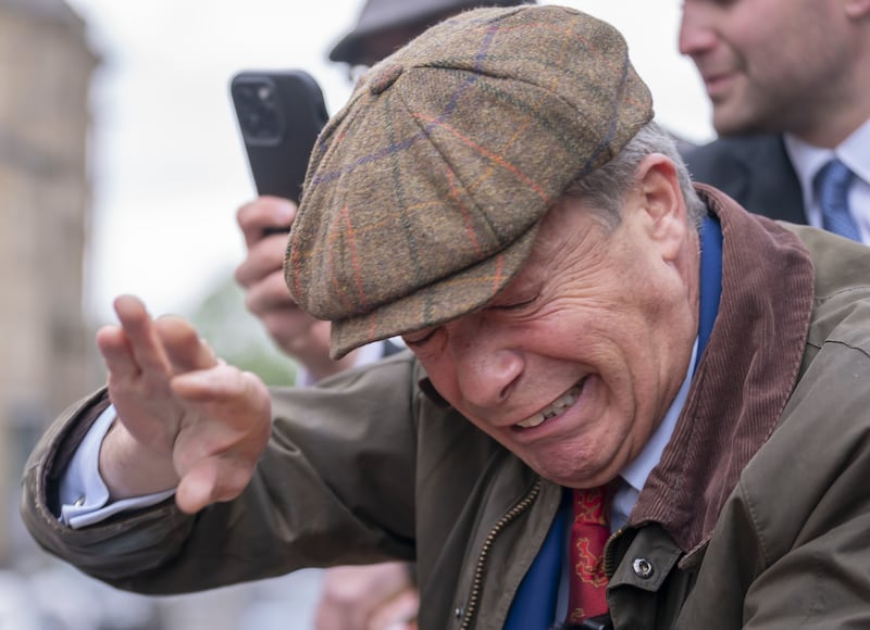 Mr Farage flinched as the object flew towards him