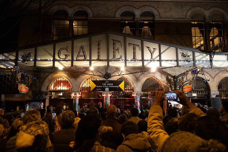 The annual Christmas Eve busk outside the Gaiety Theatre in Dublin, in aid of homeless charity, the Simon Community