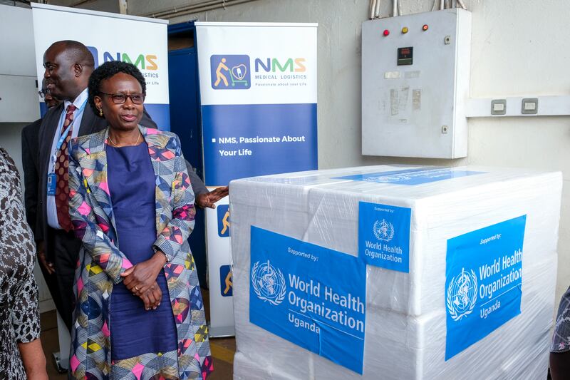 Uganda’s Minister of Health Jane Ruth Aceng receives boxes containing one of three candidate vaccines against the Sudan strain of the Ebola virus (AP/Hajarah Nalwadda)