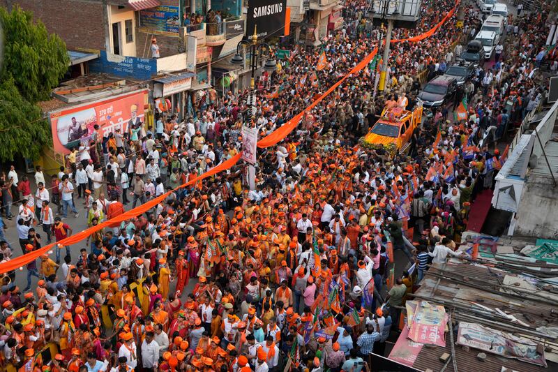 Supporters of Bharatiya Janata Party participate in a roadshow by Indian Prime Minister Narendra Modi in Varanasi (Rajesh Kumar/AP)