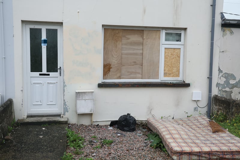 Police at the scene in Elizabeth Avenue, Larne where a house was damaged by fire. PICTURE: MAL MCCANN