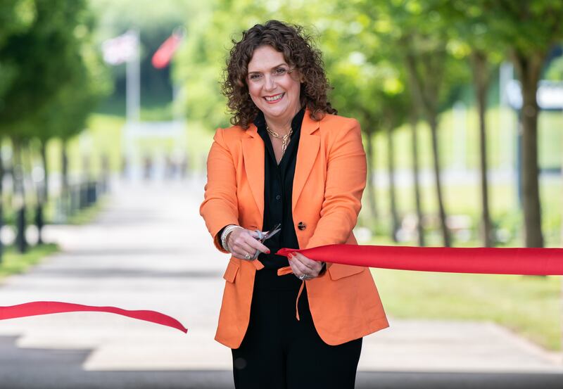 Hannah Ingram-Moore, daughter of Captain Sir Tom Moore, cuts a ribbon to officially open a walkway dedicated to her late father at the Army Foundation College in Harrogate