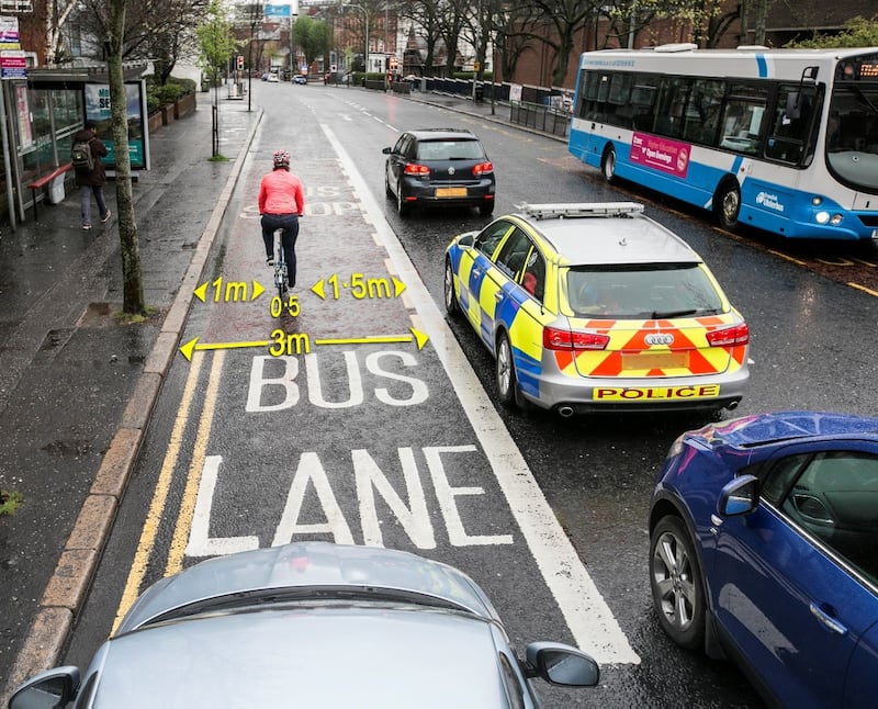 The cyclist is pictured using a bus lane in Belfast during the rush hour when there is a queue of traffic in the outside lane. It demonstrates that other vehicles using a 3 metre-wide bus lane cannot safely pass a cyclist when there is no space to overtake in the outside lane