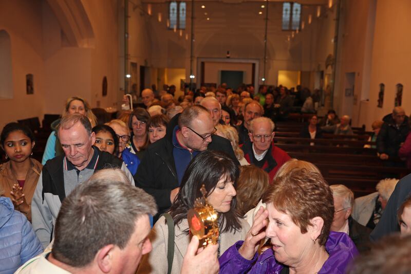 People queuing to receive a blessing from the relic of Blessed Carlo Acutis in St Nicholas' Church in Ardglass, Co Down (Bill Smyth)