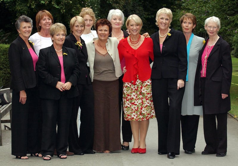 The original Calendar Girls (dressed in black trouser suits), and the actresses that play them in the film, from left to right; Christine Clancy, Penelope Wilton, Ros Fawcett, Angela Baker, Geraldine James, Julie Walters, Lynda Logan, Helen Mirren, Tricia Stewart, Celia Imrie and Beryl Bamforth
