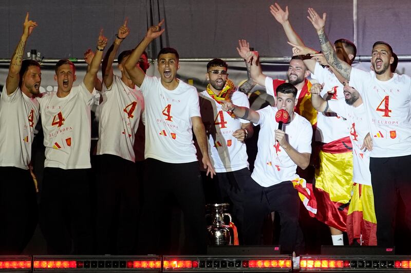 Rodri, fourth from left, and Morata, with mic, at an event in Madrid to celebrate Spain’s Euro 2024 success (Andrea Comas/AP)