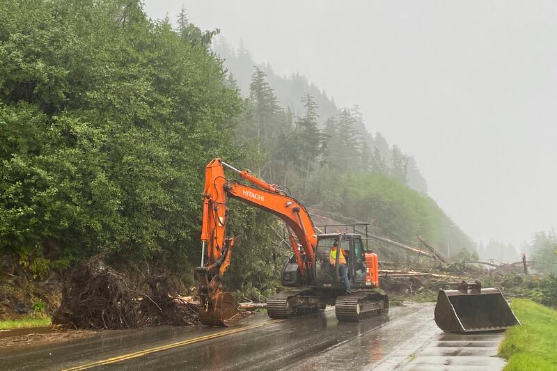 A worker clears debris after the deadly landslide in Ketchikan, Alaska (Anna Laffrey/Ketchikan Daily News/AP)