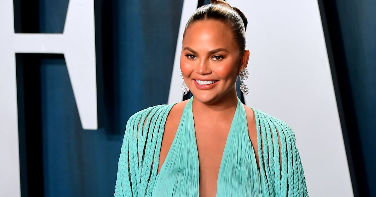 Chrissy Teigen has one breast larger than the other - 8days