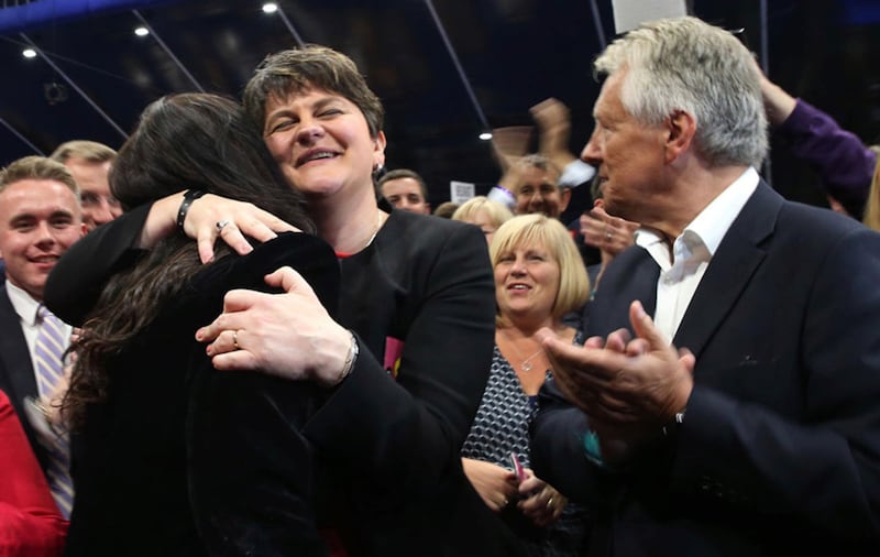 DUP leader Arlene Foster hugs new South Belfast MP Emma Little Pengelly as former leader Peter Robinson looks on. Picture: Hugh Russell&nbsp;
