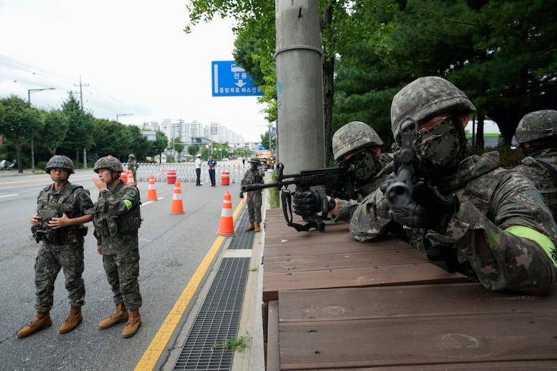 South Korean soldiers aim their machine guns as part of the Ulchi Freedom Shield military exercise with the US in Seoul (Ahn Young-joon/AP)