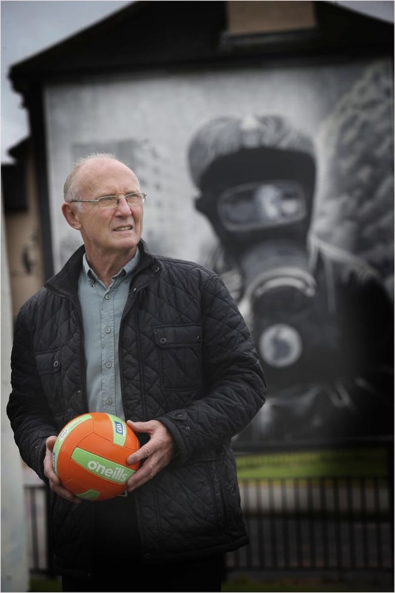 Tom McGuinness pictured in front of the famous 'Petrol Bomber' mural in the Bogside area of Derry city. Picture by Hugh Russell