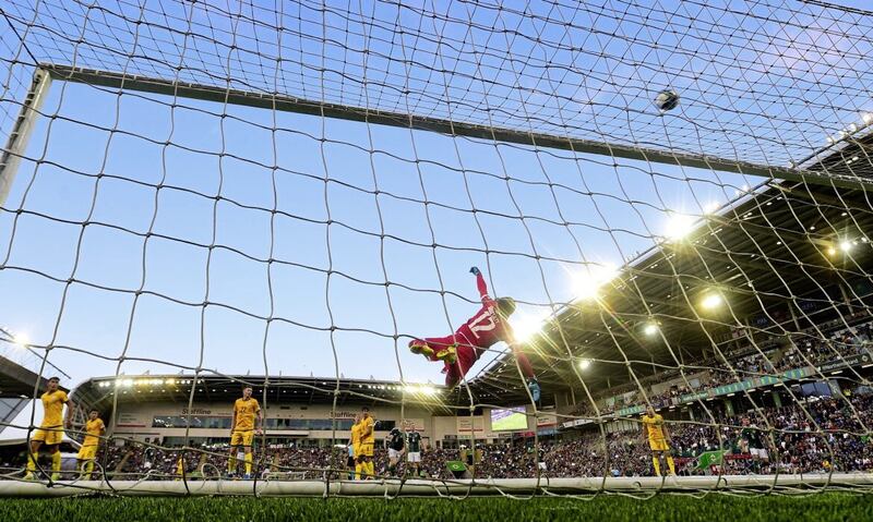 Kazakhstan goalkeeper Igor Shatskiy saves superbly from Northern Ireland substitute Conor McMenamin. Pic Colm Lenaghan/Pacemaker 