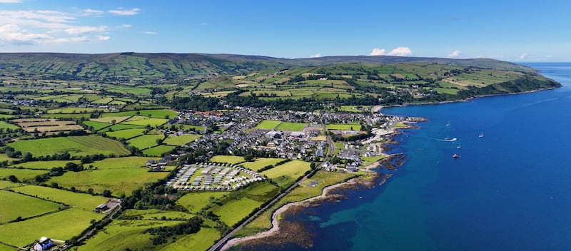 Panoramic aerial view of Cushendall Village on the Irish Sea Co Antrim Northern Ireland on a sunny day with a blue sky