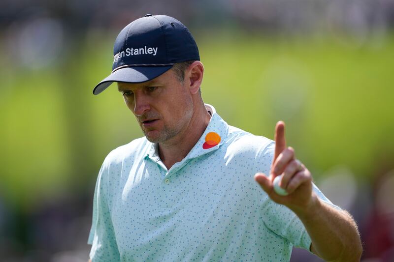 Justin Rose waves after making a putt on the 15th hole during the third round of the US PGA Championship (Matt York/AP)