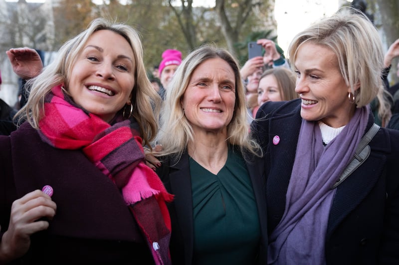 Kim Leadbeater (centre) is joined by campaigner and cancer sufferer Sophie Blake (left) and Rebecca Wilcox (daughter of Esther Rantzen (far right) after hearing the result of the vote