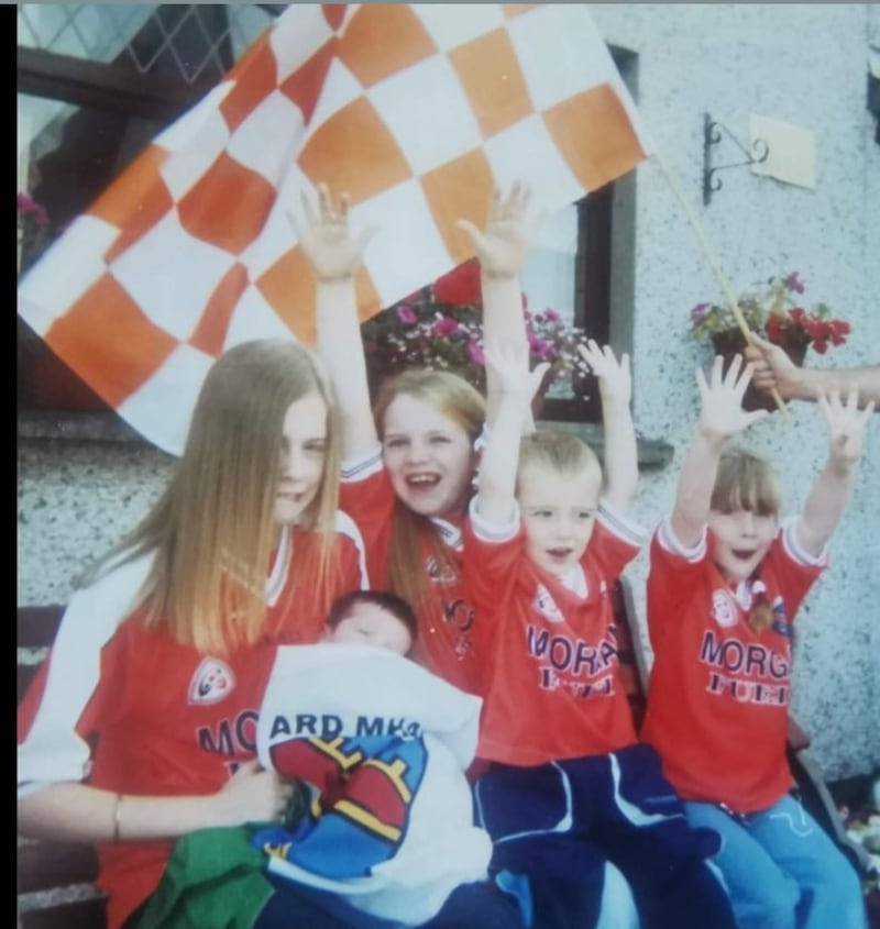 Aimee Duffy, Catriona Duffy, Séanna Duffy, Oisin Duffy and Sinead Duffy wearing Armagh jerseys cheering