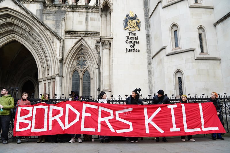 Protesters outside the the Royal Courts Of Justice in London for Wednesday’s hearing