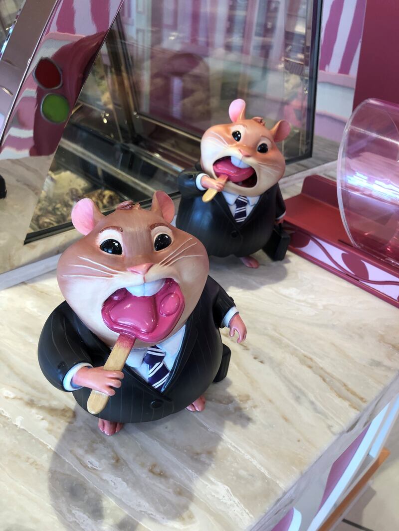 Two lemmings devour pawsicles inside the Jumbeaux’s Sweets ice cream parlour on the Disney Treasure