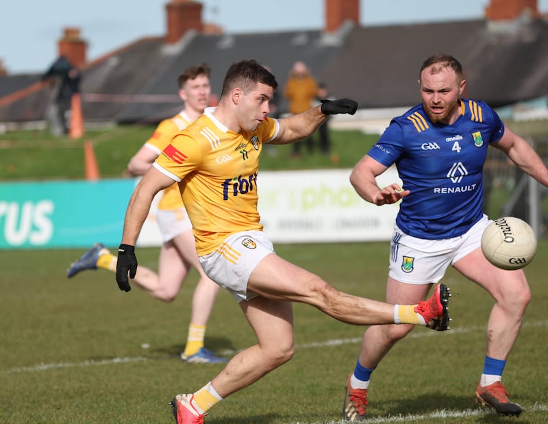 Antrim’s Patrick McBride  scores a point  during Sunday’s Allianz Football League Roinn 3 game at Corrigan Park in Belfast
PICTURE COLM LENAGHAN