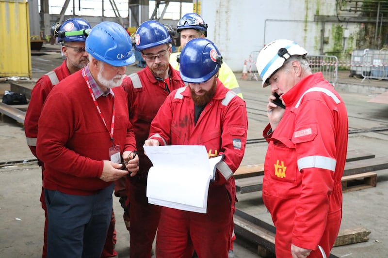 Underframe designer David Crone goes through the designs and the drawings with the apprentices to make sure he hasn't printed them upside down.