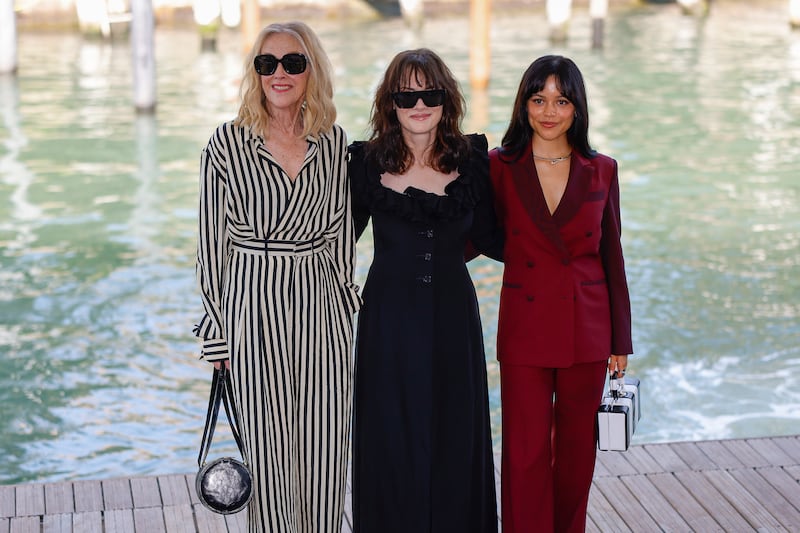 From left, Catherine O’Hara, Winona Ryder and Jenna Ortega at the Venice Film Festival (AP)