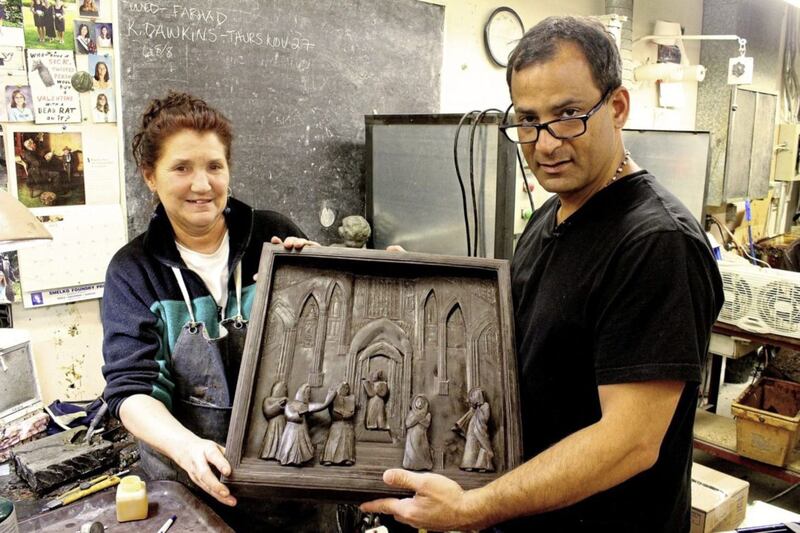 Farhad with one of the bas relief sculptural pieces from the Marian Doors he created for St Michael&#39;s Cathedral Basilica 