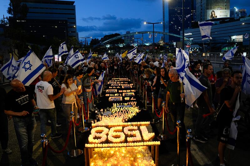 People protest against Israeli Prime Minister Benjamin Netanyahu’s government and call for the release of hostages held in Gaza by Hamas, in Tel Aviv, Israel (Ariel Schalit/AP)